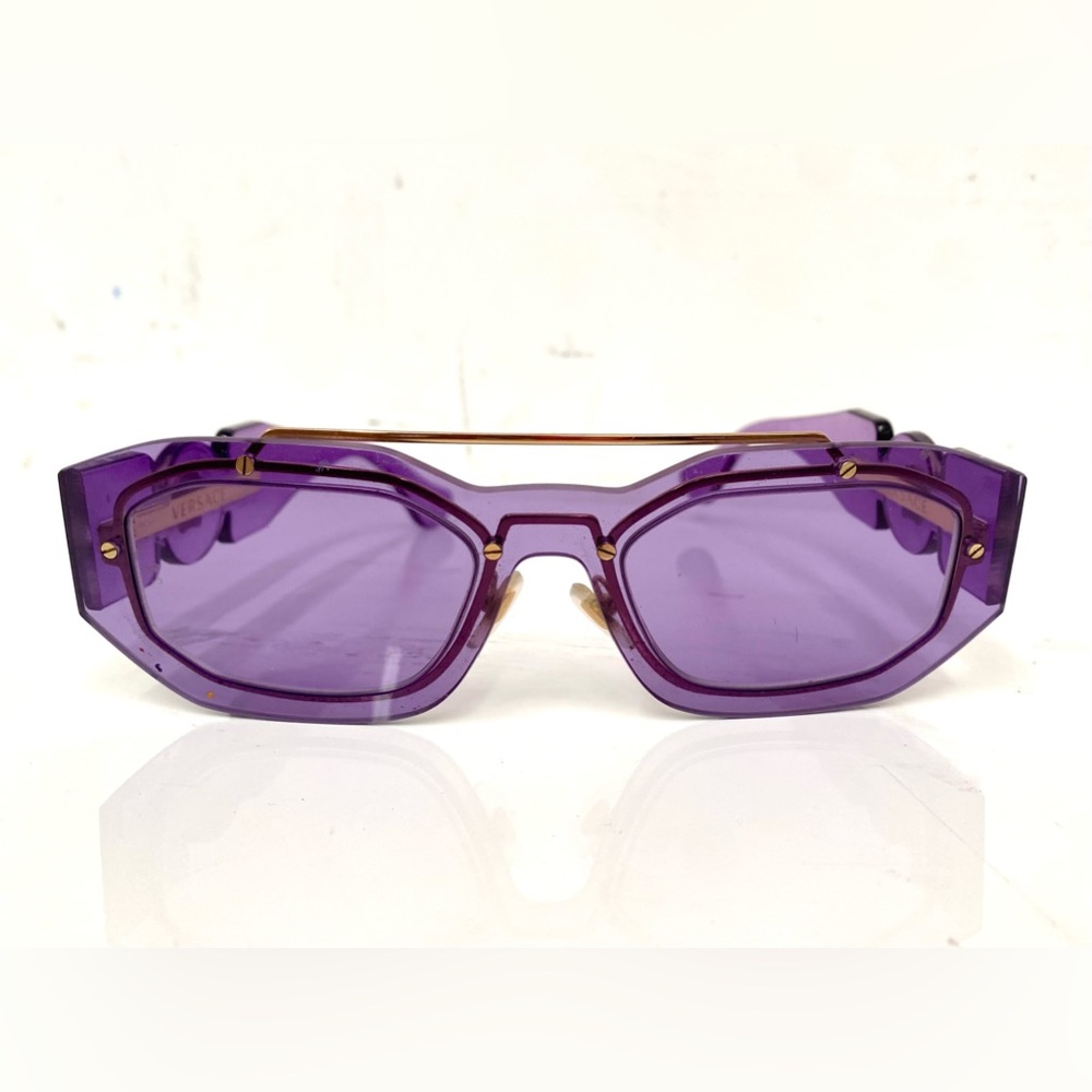 Purple Versace sunglasses.